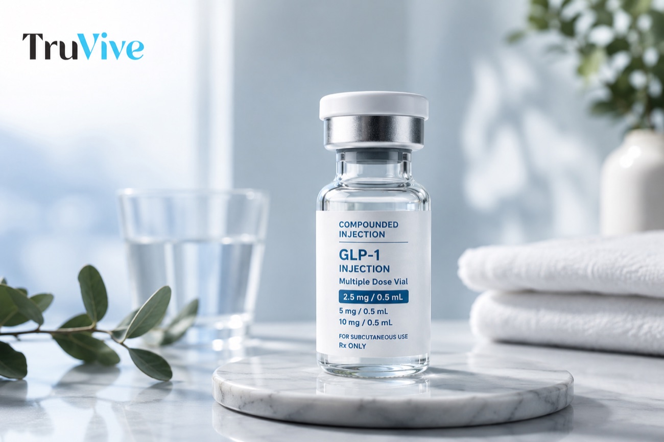 TruVive compounded GLP-1 injection vial on a marble tray